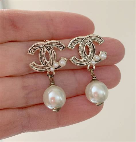 chanel dangling pearl earrings price|authentic Chanel logo stud earrings.